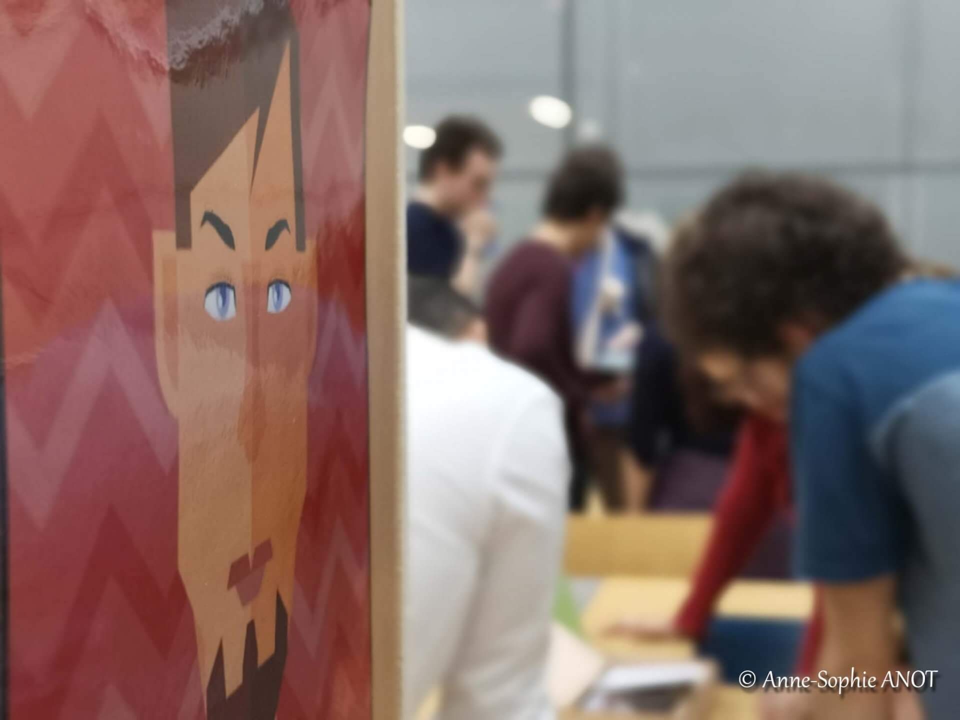 Personnes qui travaillent ensemble avecun dessin en premmier plan